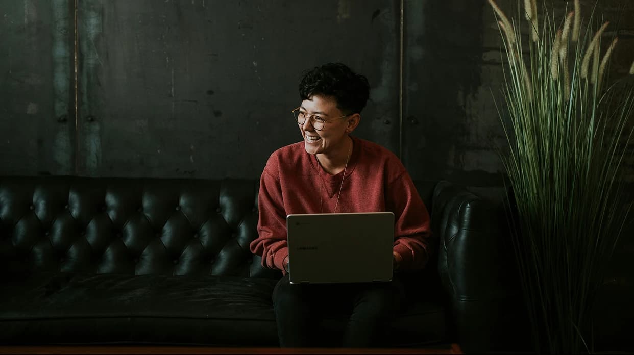 Person on laptop smiling